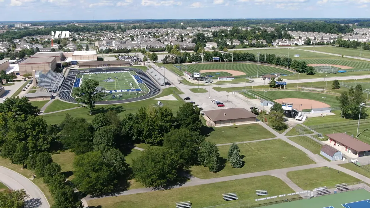 Aerial view of a Mount Vernon High School campus with football field and sports facilities in McCordsville, Indiana