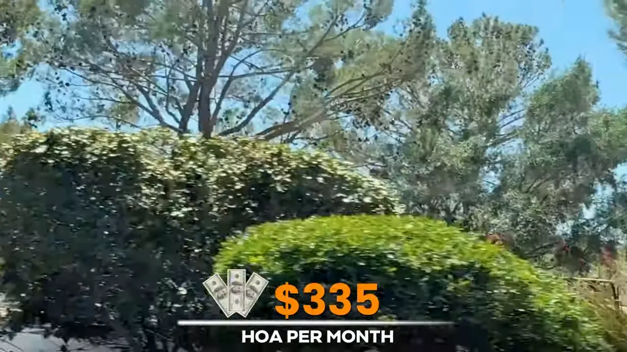 Landscaped community roadway with on screen text showing three hundred thirty five dollar HOA per month