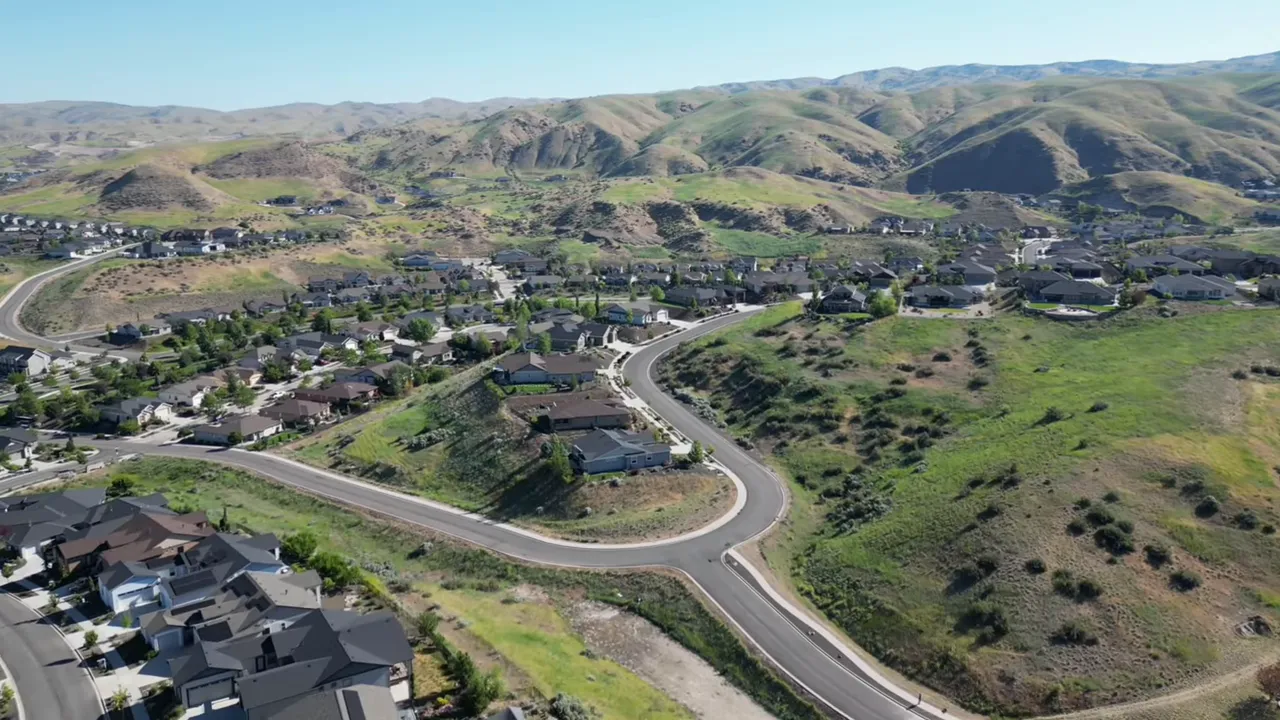Clear aerial photo of foothill neighborhood with winding roads and open space