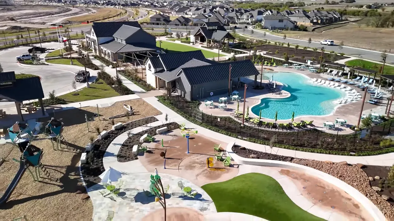 Aerial view of Flora in Hutto Texas showing resort-style pool and outdoor amenities