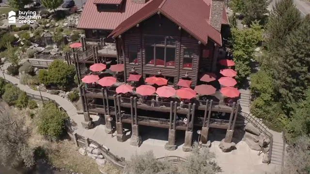 Taprock Northwest Grill riverfront deck with red umbrellas