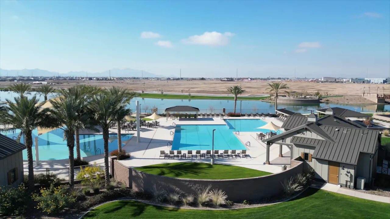 Large outdoor pool and palm trees at Barney Farms aquatic center