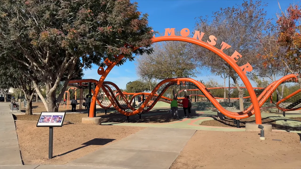 Orange Monster climbing structure at Eastmark park