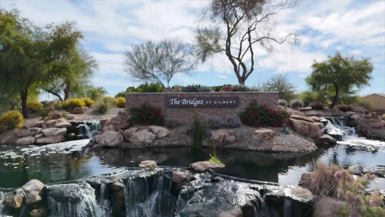 Waterfall monument and pond at The Bridges community
