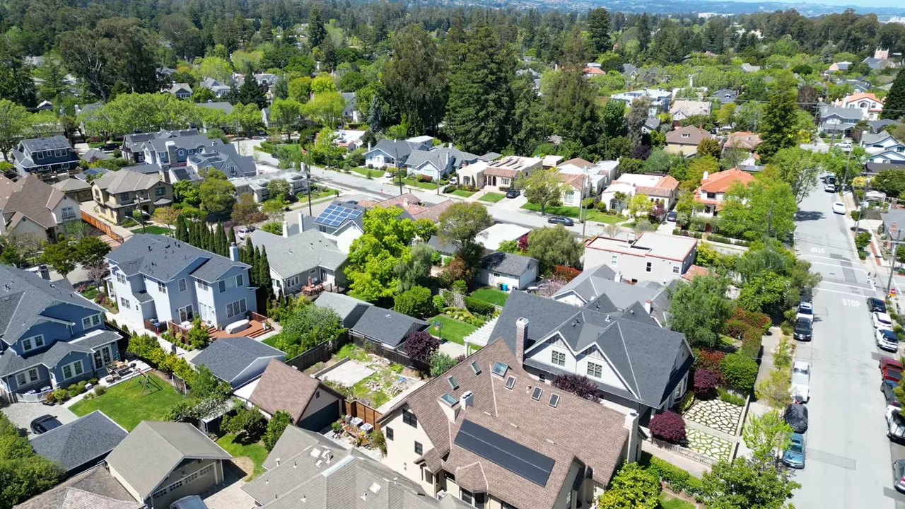 High-resolution drone photo of San Mateo County homes and streets illustrating variation between properties.