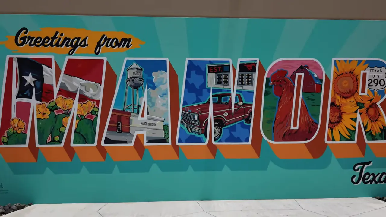 Greetings from Manor Texas mural with colorful postcard lettering