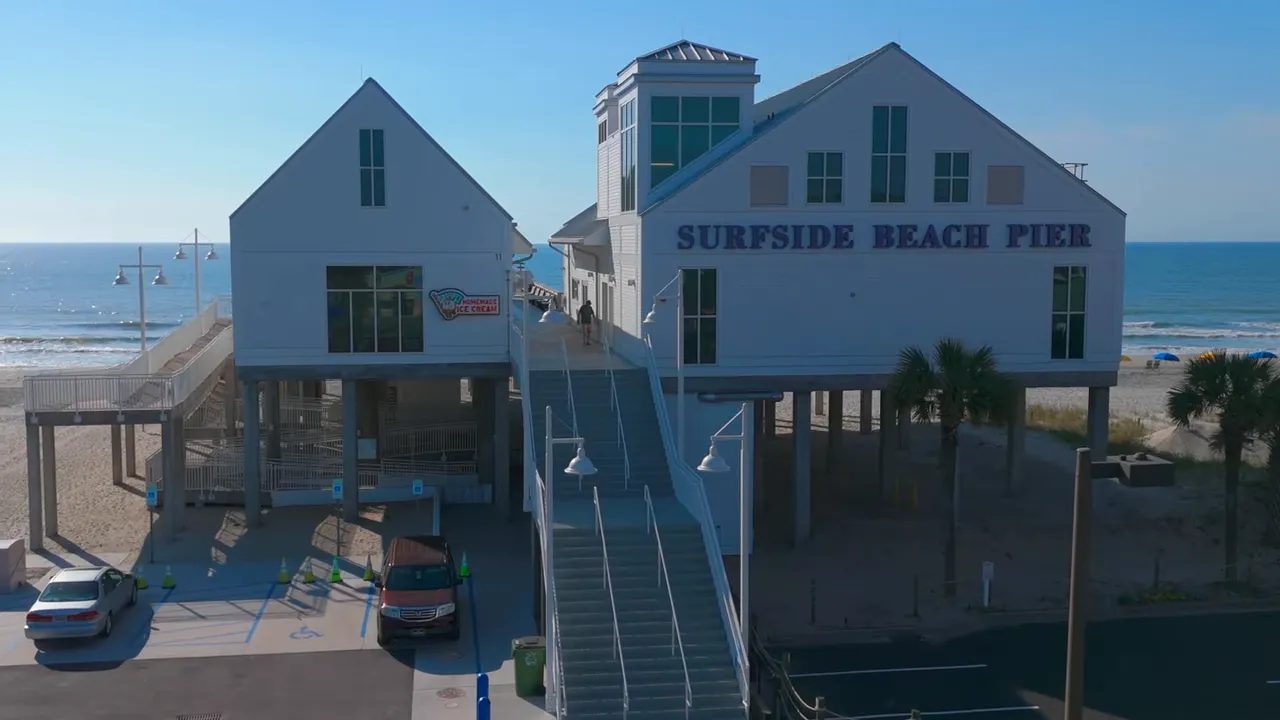 Surfside Beach Pier landmark building with the Atlantic Ocean in the background