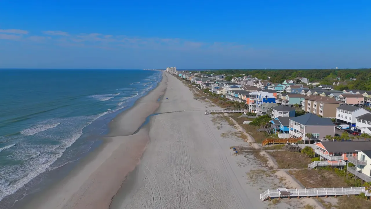 Aerial view of Surfside Beach with long sandy beach and ocean