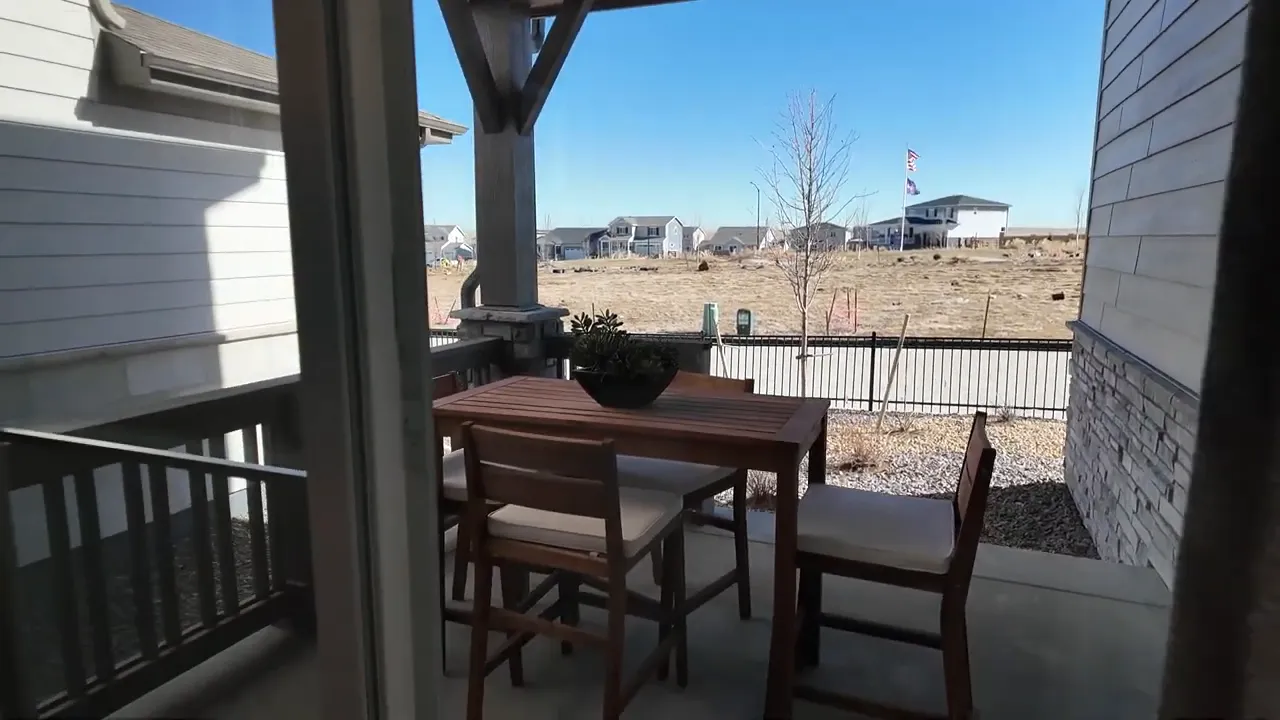 Covered patio seating and table at Tri Pointe at Aurora Highlands