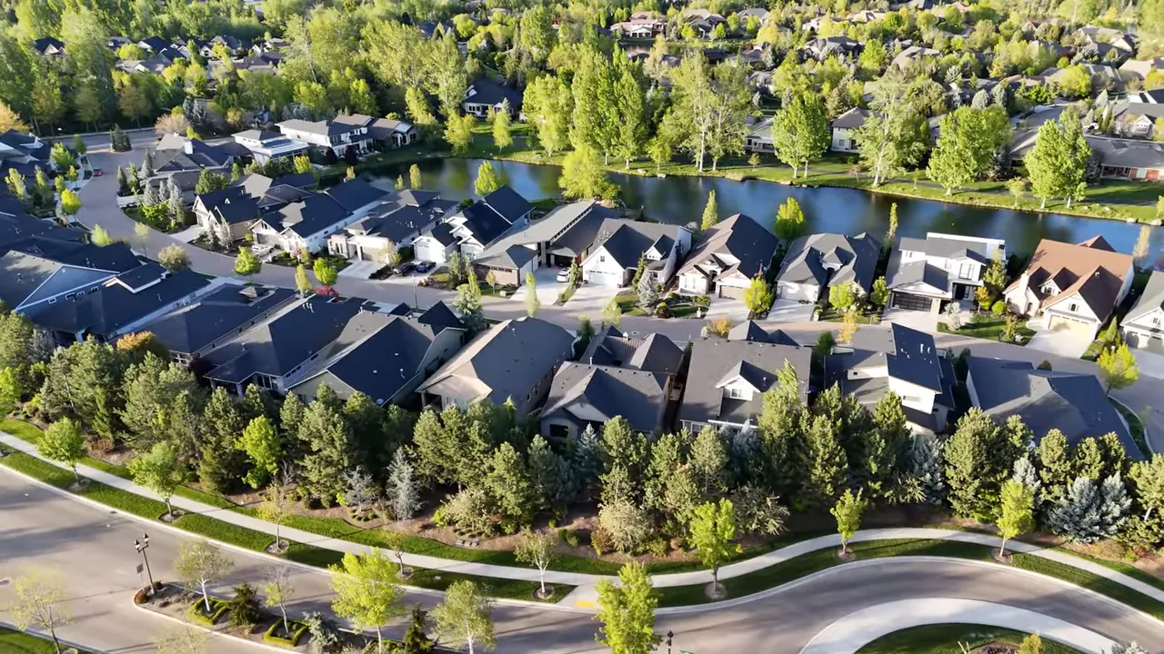 Aerial view of an Eagle, Idaho neighborhood with green landscaping and winding roads