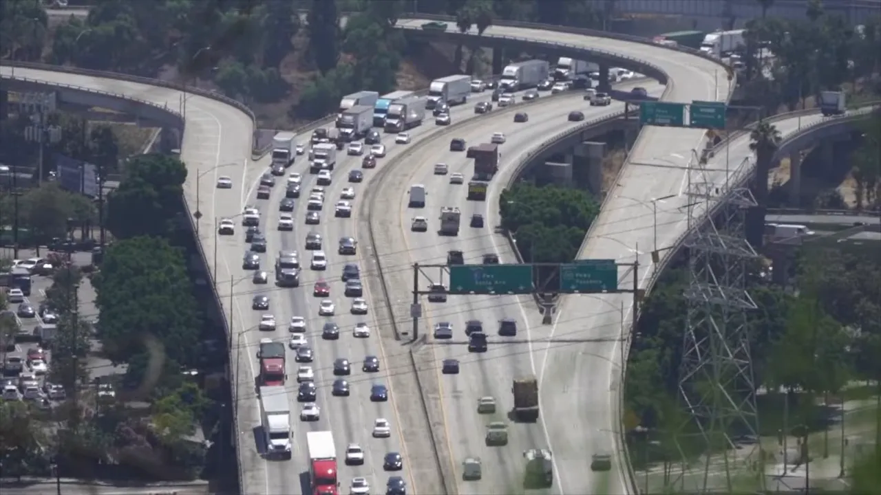 Multi lane freeway filled with heavy traffic and brake lights