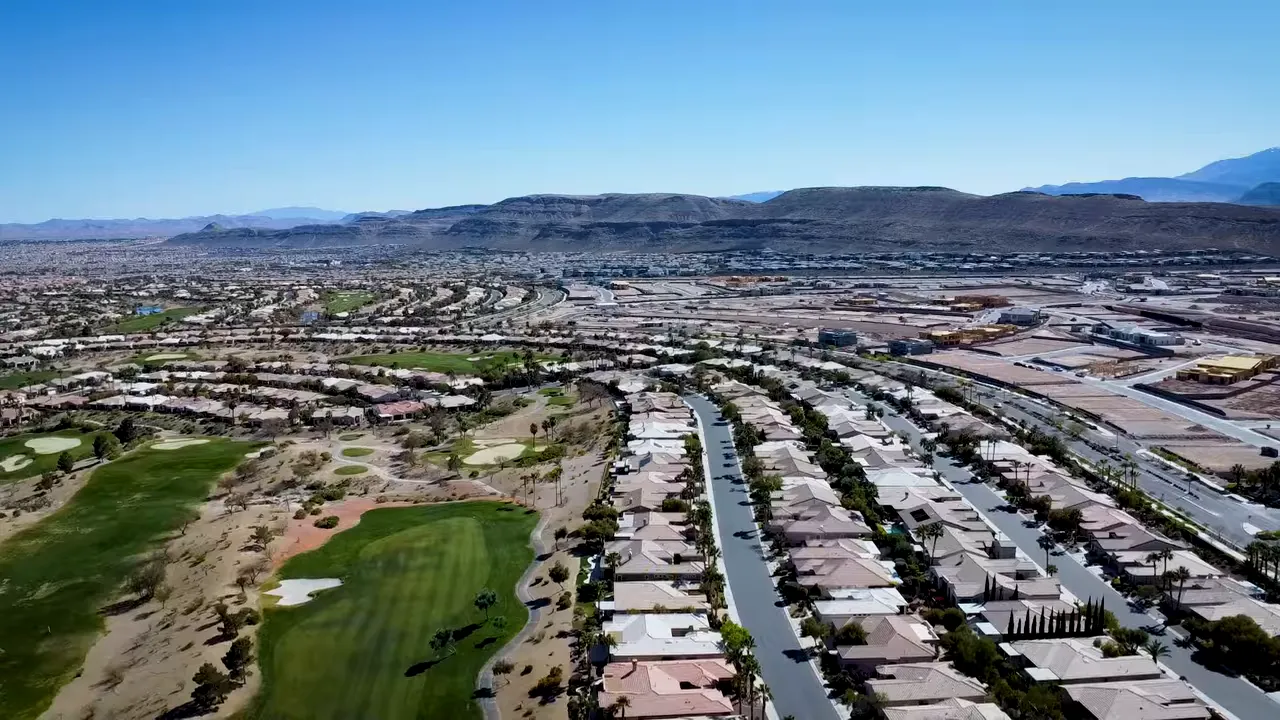 Aerial view of Las Vegas homes and golf course with text about retirees in 55 plus communities