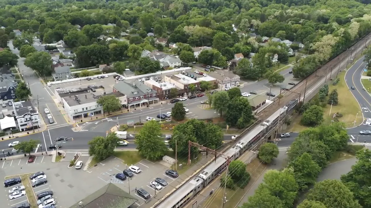 Aerial view of a town center with train tracks indicating commuter access near Randolph NJ