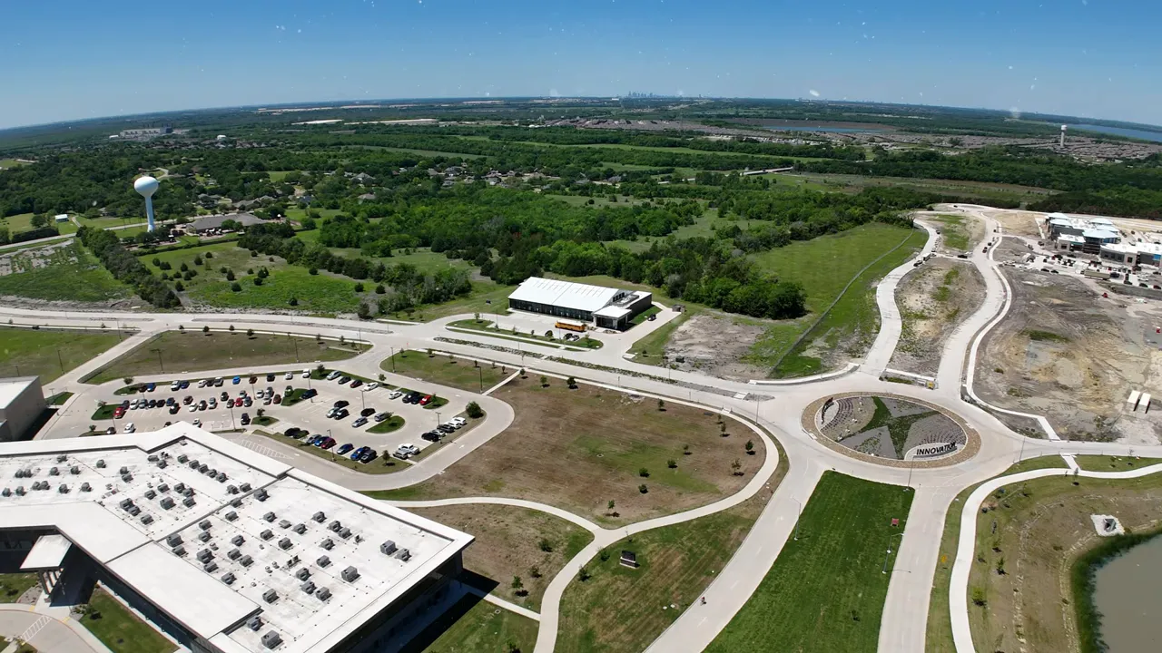 Aerial campus view with text reading 600 seat auditorium