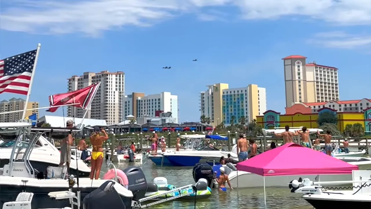 Boats at Pensacola harbor with the Blue Angels flying overhead