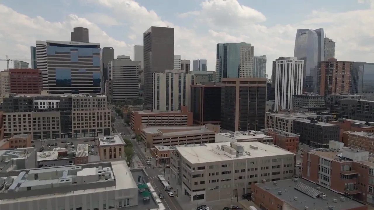 Aerial view of Denver skyline with downtown buildings and streets