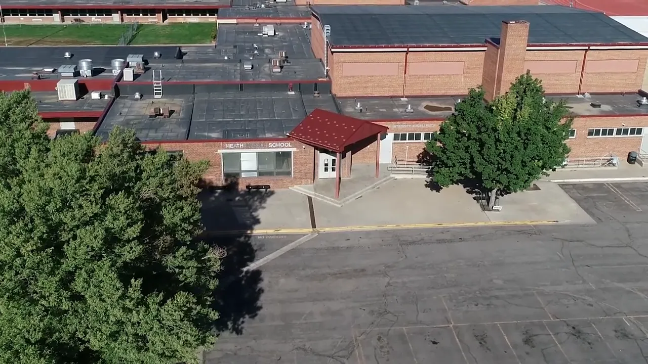 Aerial view of Heath School campus with rooflines, entrances, and courtyard