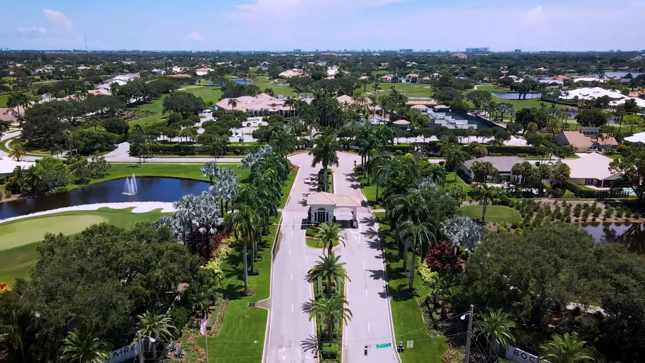 Aerial view of Bocaire community showing open lots and clubhouse