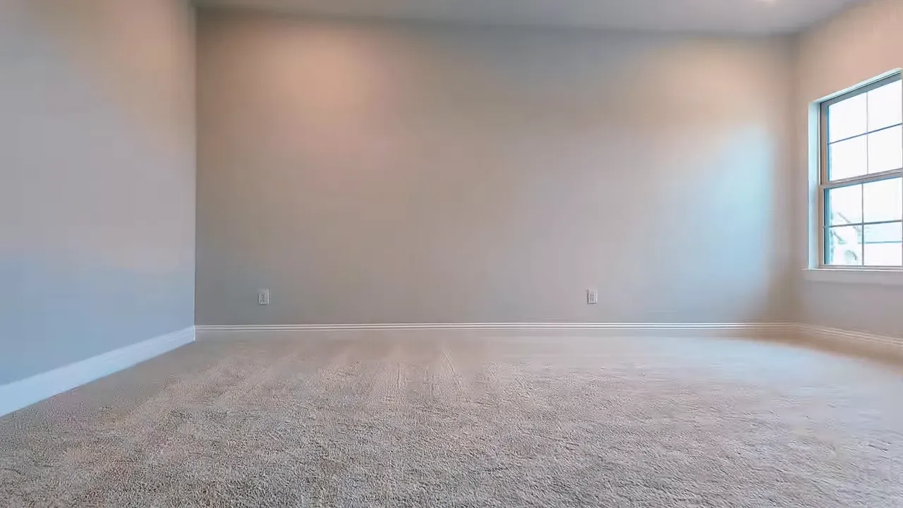 Upstairs bedroom with neutral carpet, light walls, and window in a Frisco TX new construction home