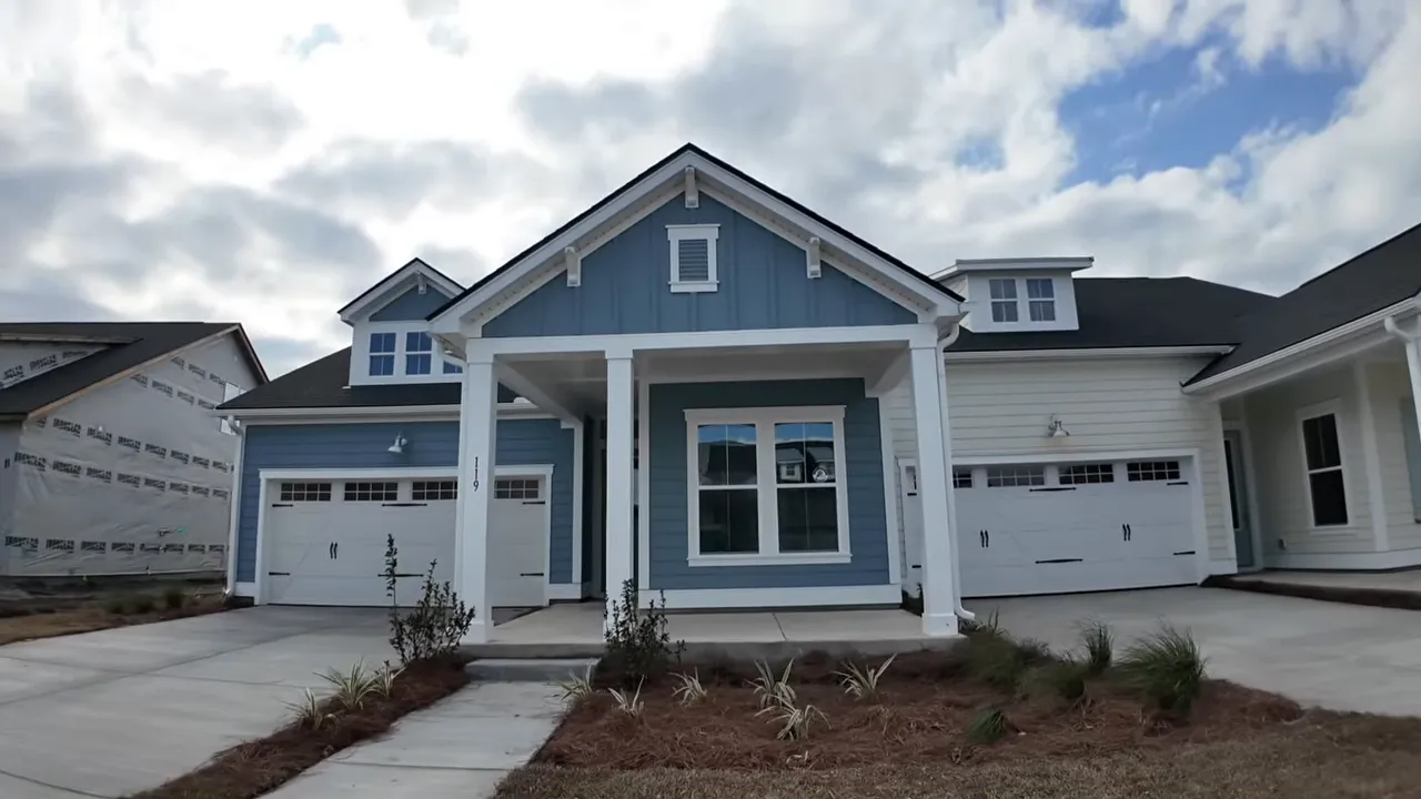 Newer home exterior in Summerville SC with two-car garage and front porch