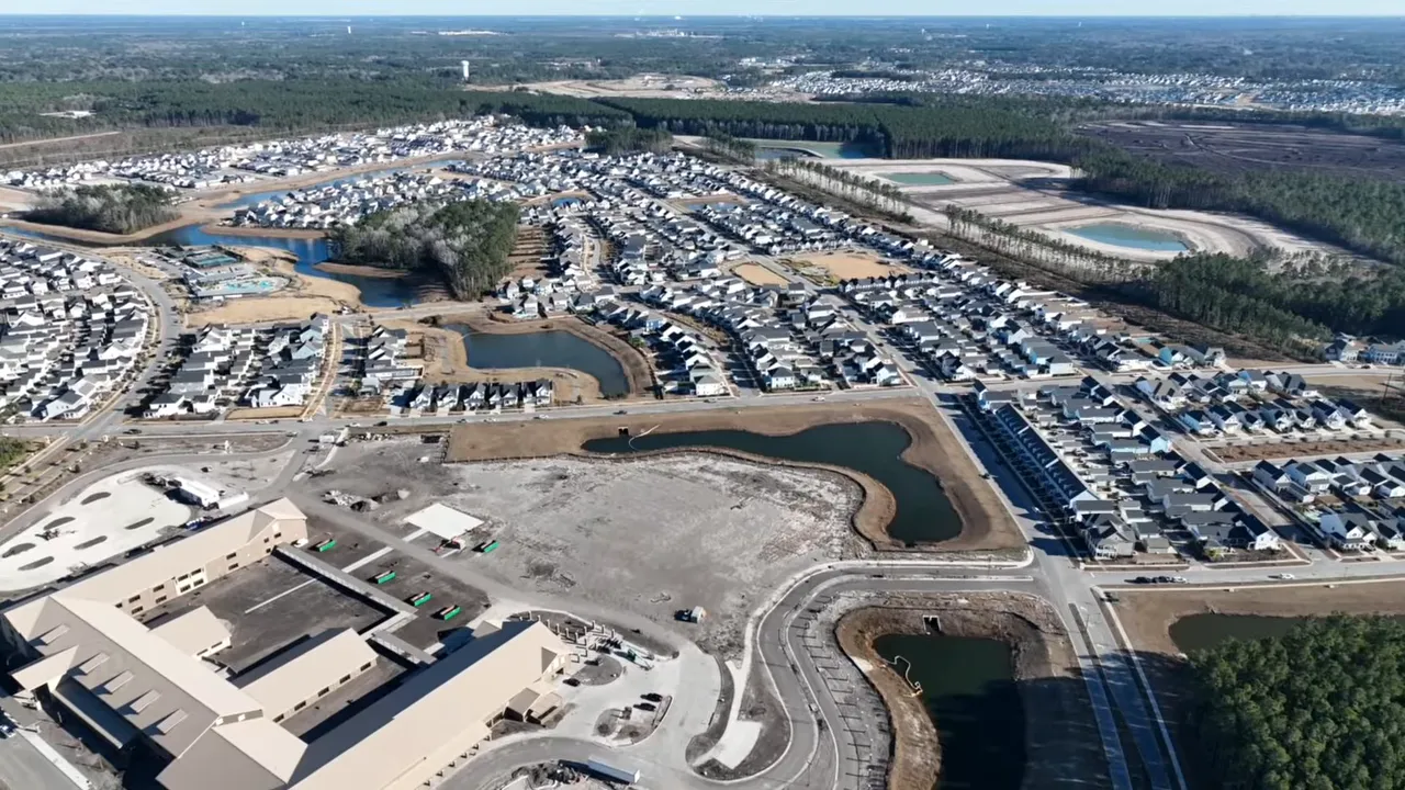 Aerial view of a master-planned Summerville SC community with retention ponds and roads