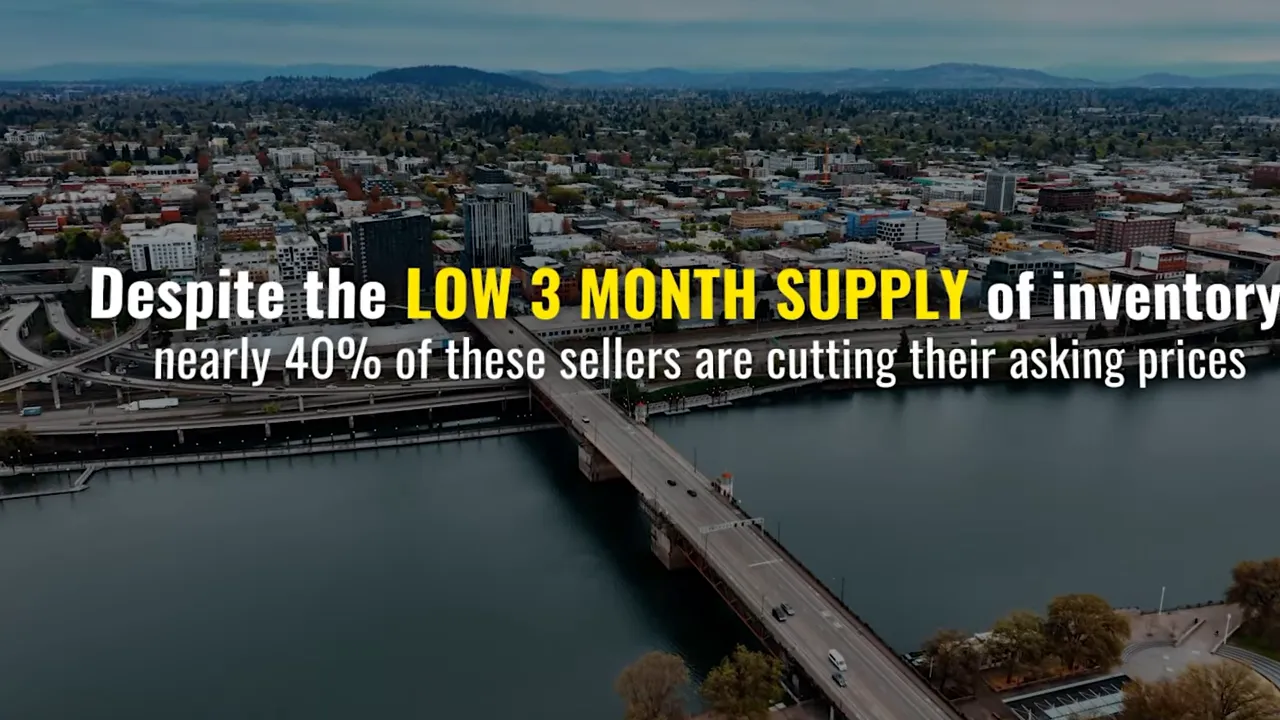 Aerial view of Portland Oregon with on-screen text saying nearly 40% of sellers are cutting asking prices despite low 3-month inventory supply
