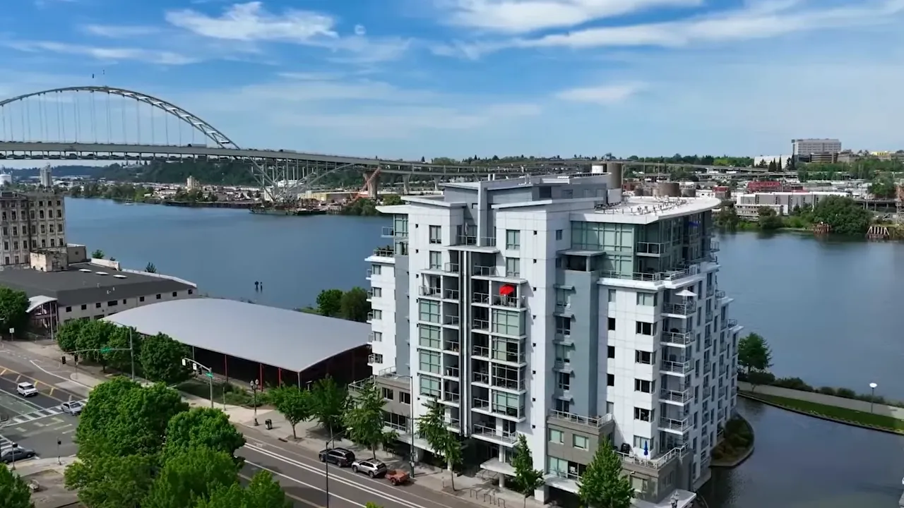Aerial view of modern high-rise condominiums near a river in Portland, Oregon