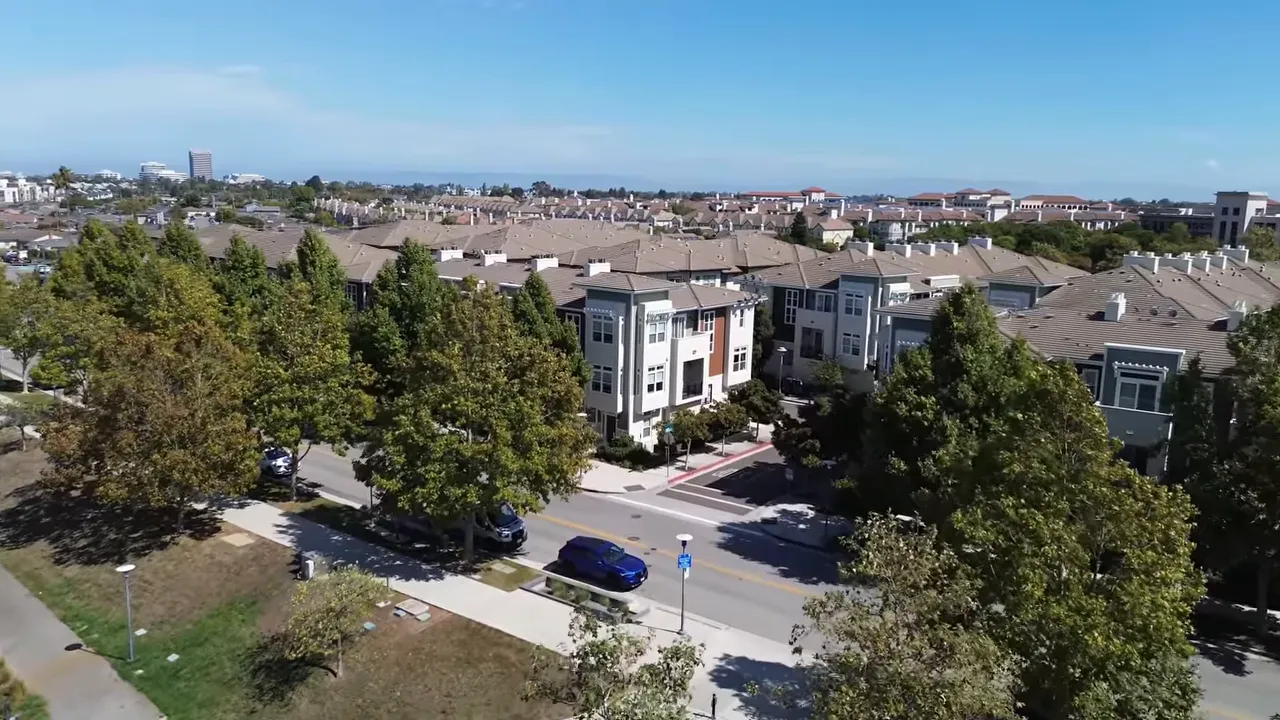 Aerial view of modern Bay Meadows townhomes and tree lined streets