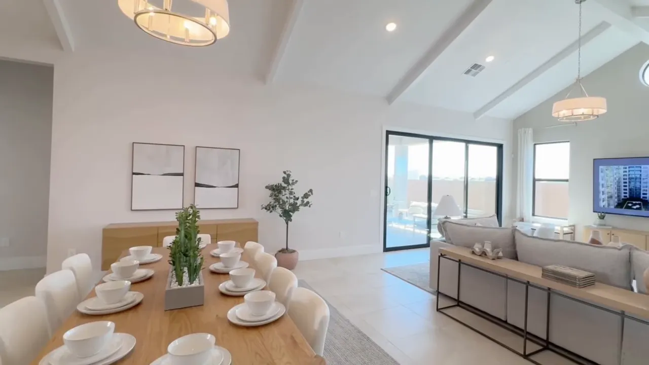 Bright staged model home living room and dining area