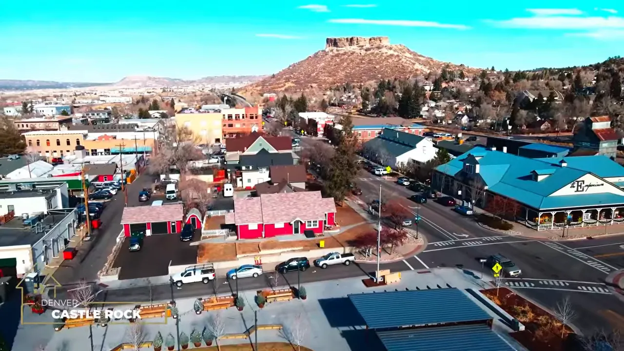 Aerial view of downtown Castle Rock with prominent rocky butte