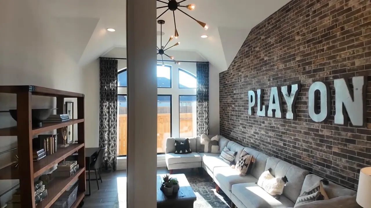 Bonus room with brick accent wall bunk beds and play on lettering