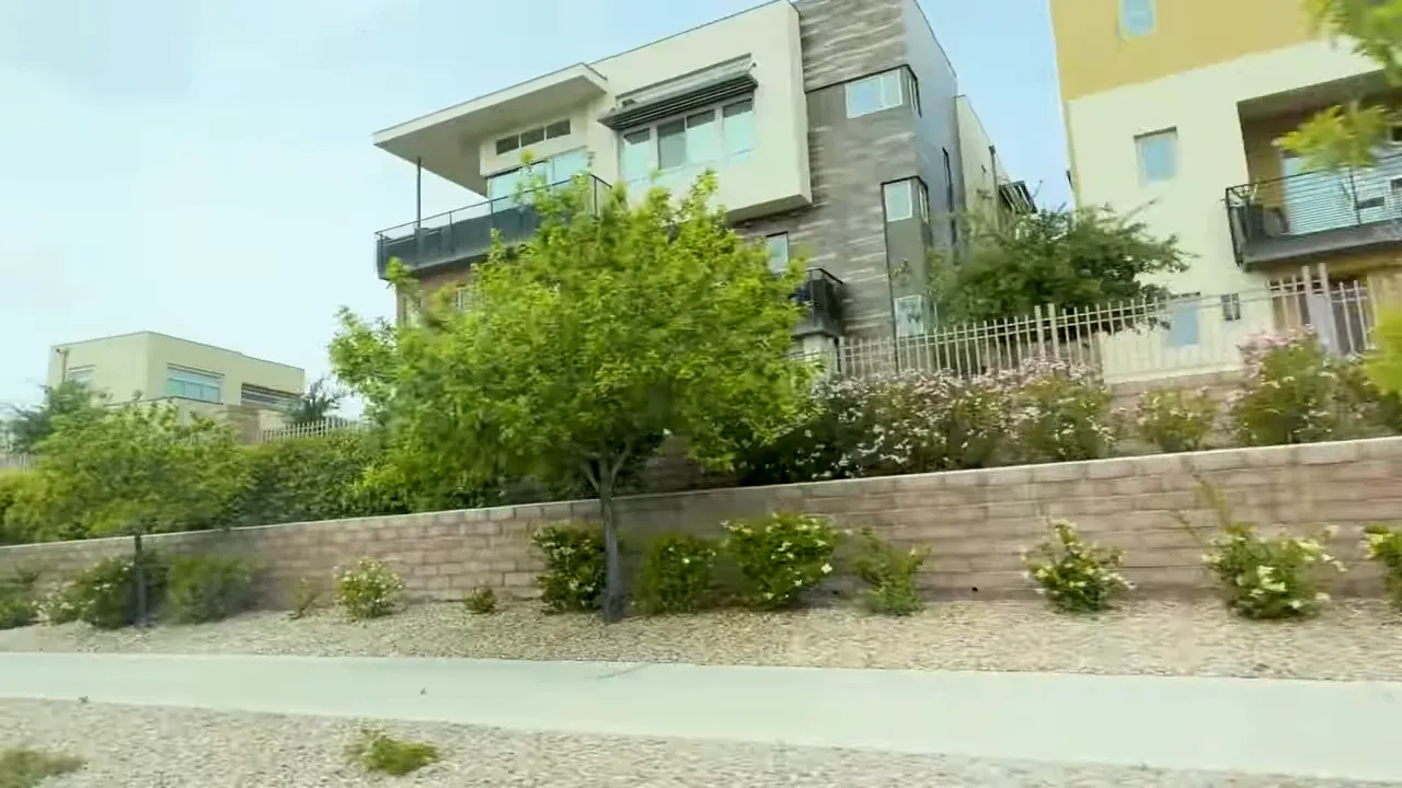 Trilogy Summerlin modern townhome exterior with shrubs and trees