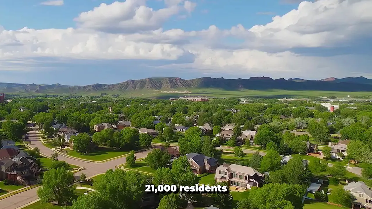 Aerial view of Louisville, Colorado with on-screen text indicating 21,000 residents