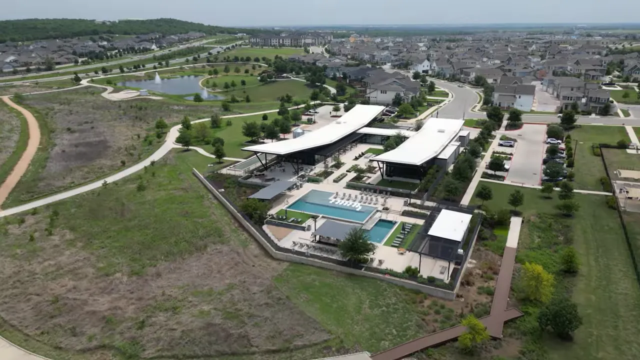 Aerial view of paved trails winding through Easton Park homes and amenities