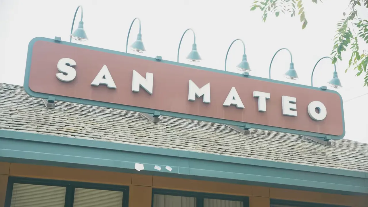 Sign for San Mateo restaurant storefront seen from street level