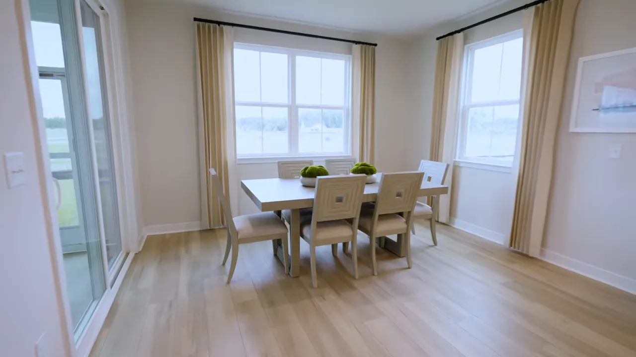 Designated dining area in a new construction home with large windows