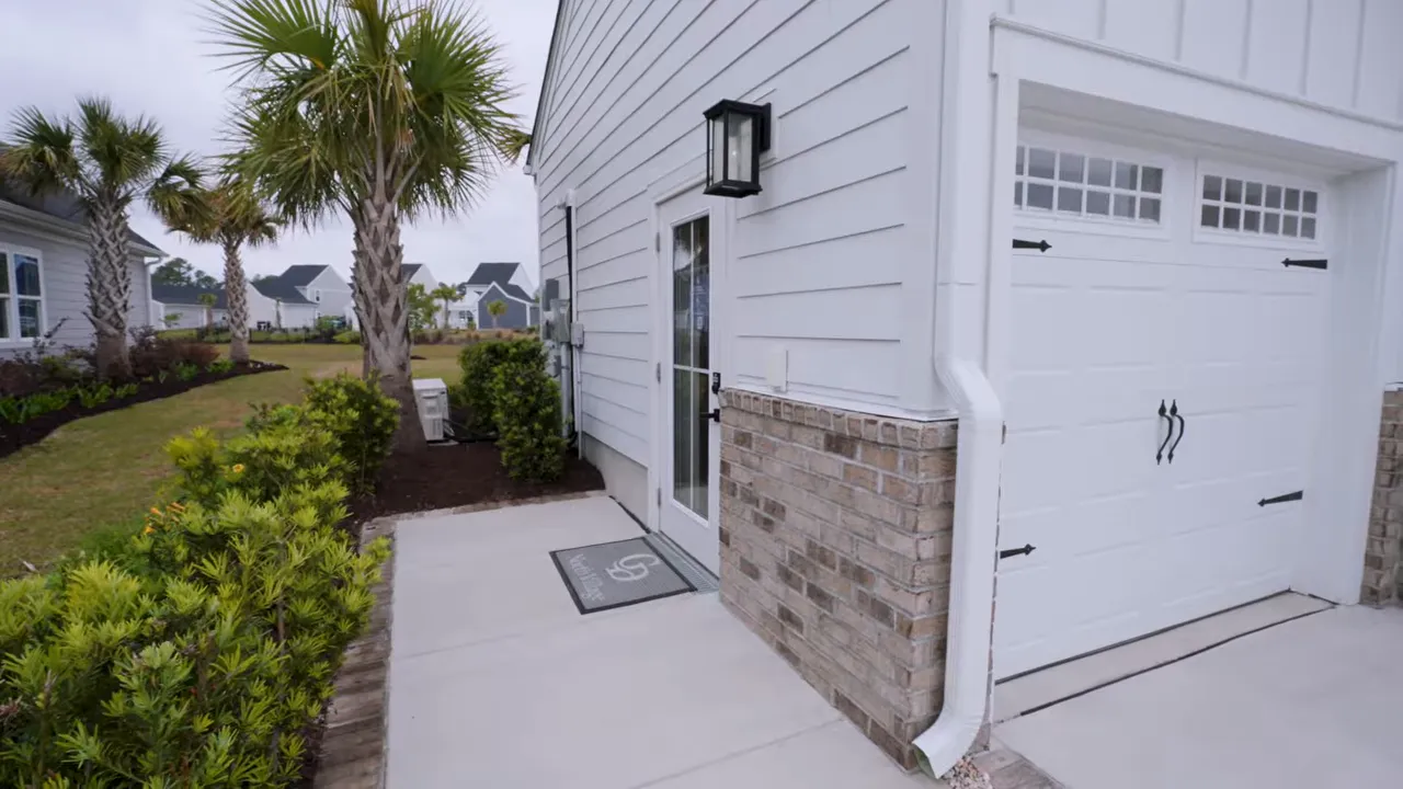 Wide driveway and garage side corner at a new construction home in Myrtle Beach gated community