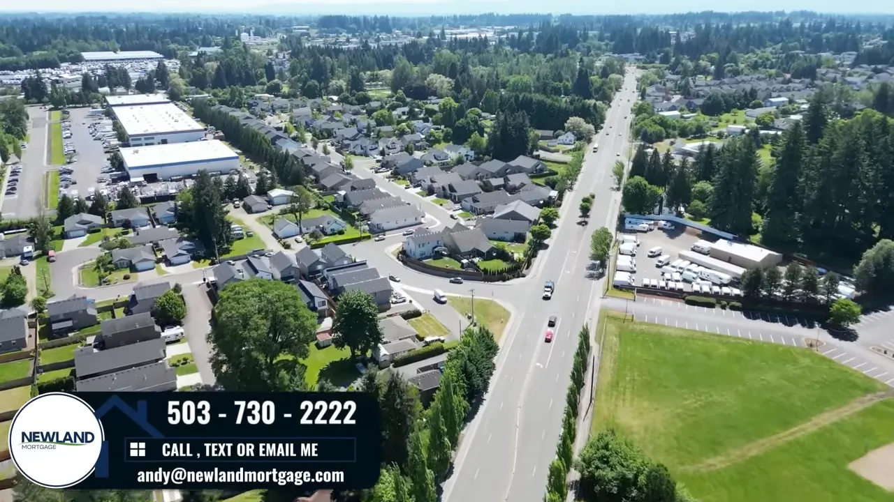 Aerial view of a residential street with houses and commercial area near Portland and Vancouver