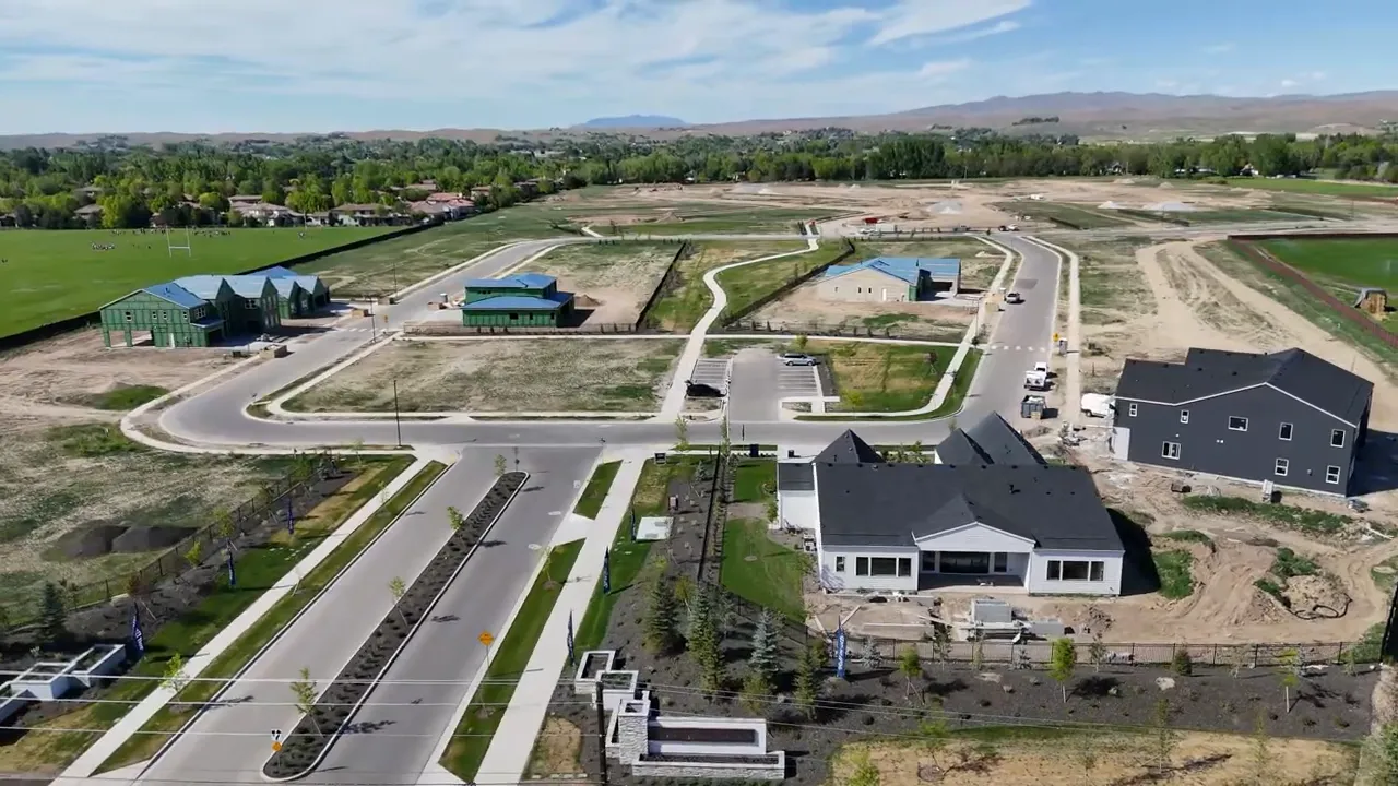 Aerial view of roads, lots, and homes under construction at Carrera Estates