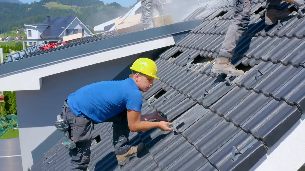 Contractor installing or repairing a large roof on a multi-unit building