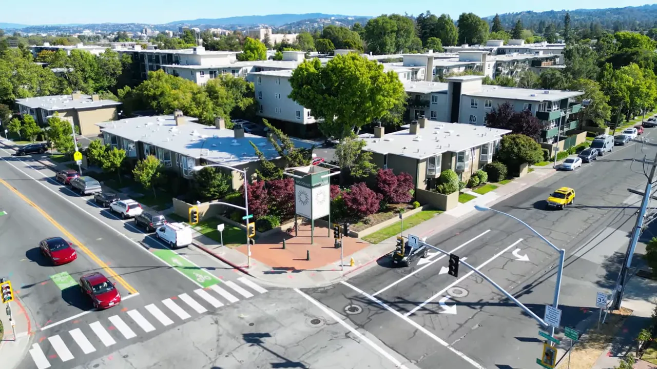 Aerial view of a condo community showing multiple buildings and parking areas