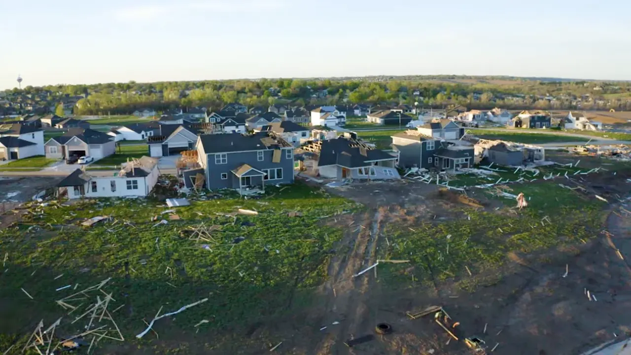 Aerial view of an Omaha neighborhood with new home construction and scattered framing