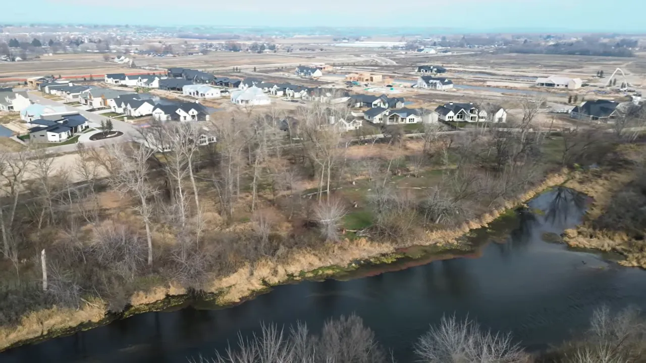 Aerial view of homes and a pond in the Boise Idaho area neighborhood