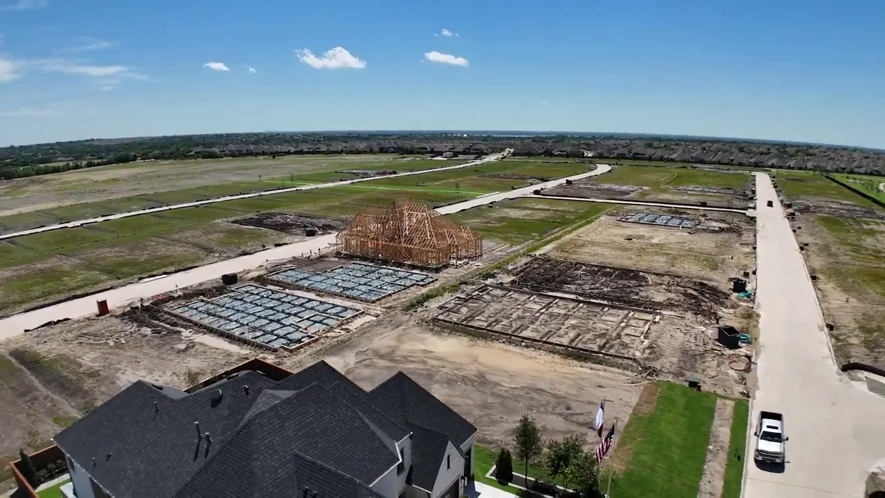Aerial view of early phase neighborhood lots and new streets