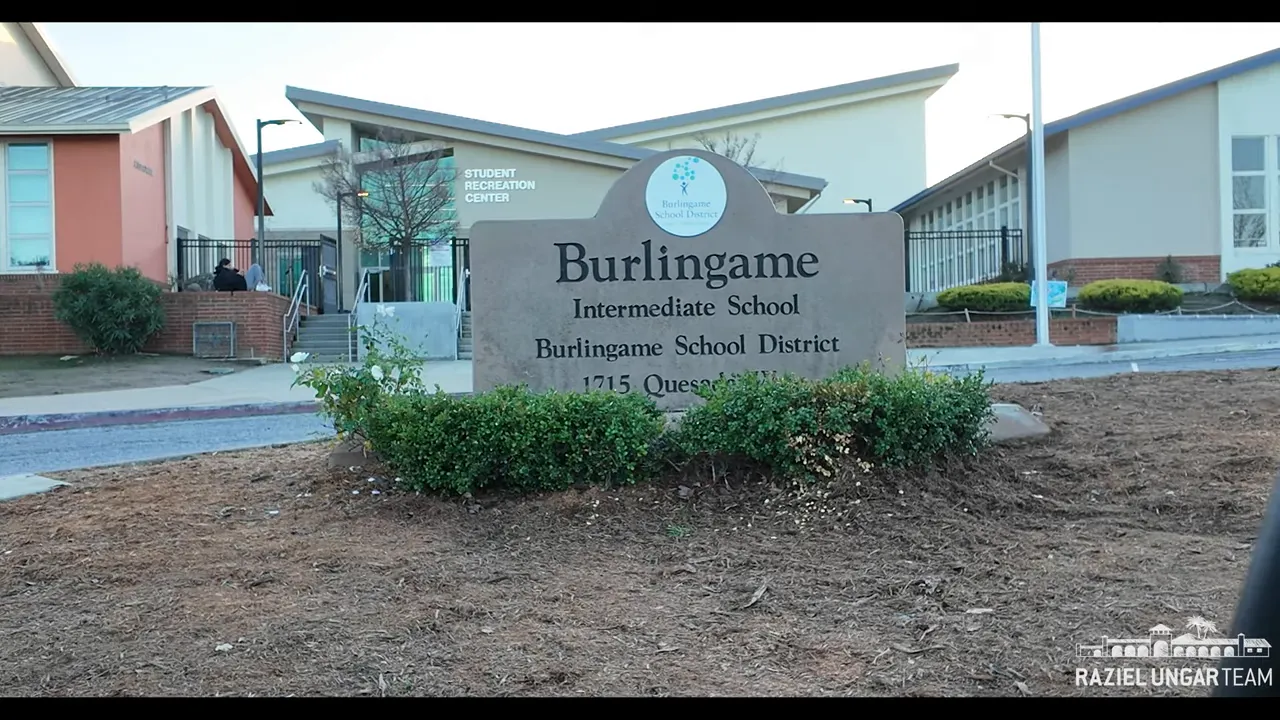 Stone sign reading 'Burlingame Intermediate School' in front of the school entrance