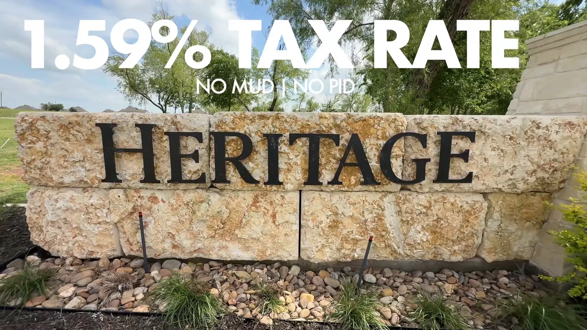 Community sign showing low tax rate and no MUD or PID fees