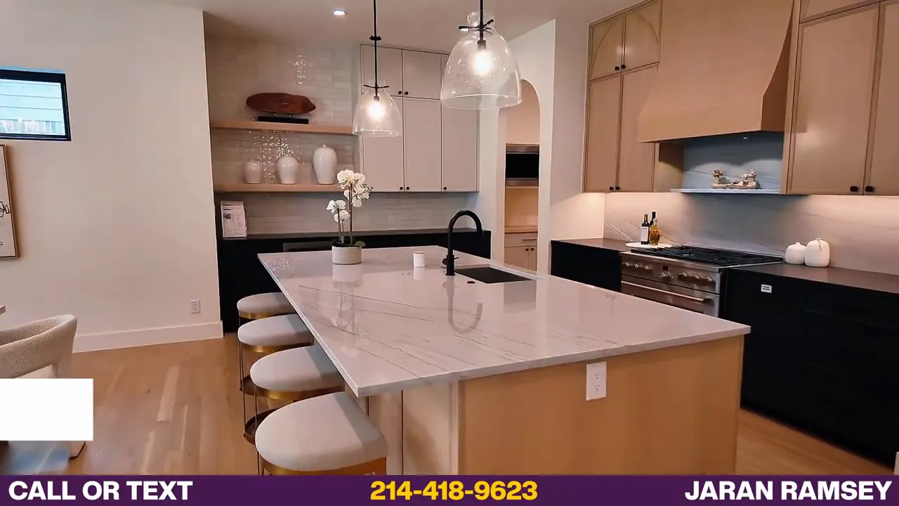 large kitchen island with pendant lights and seating