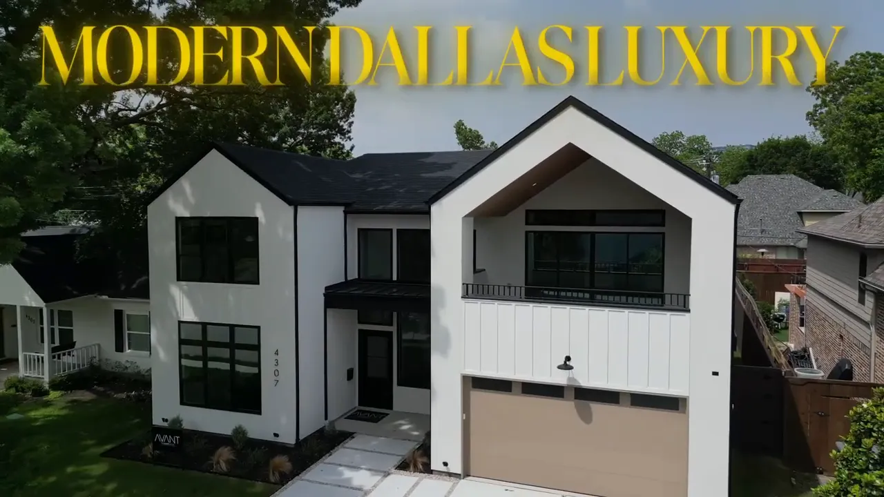 front exterior of modern white home with black trim and garage