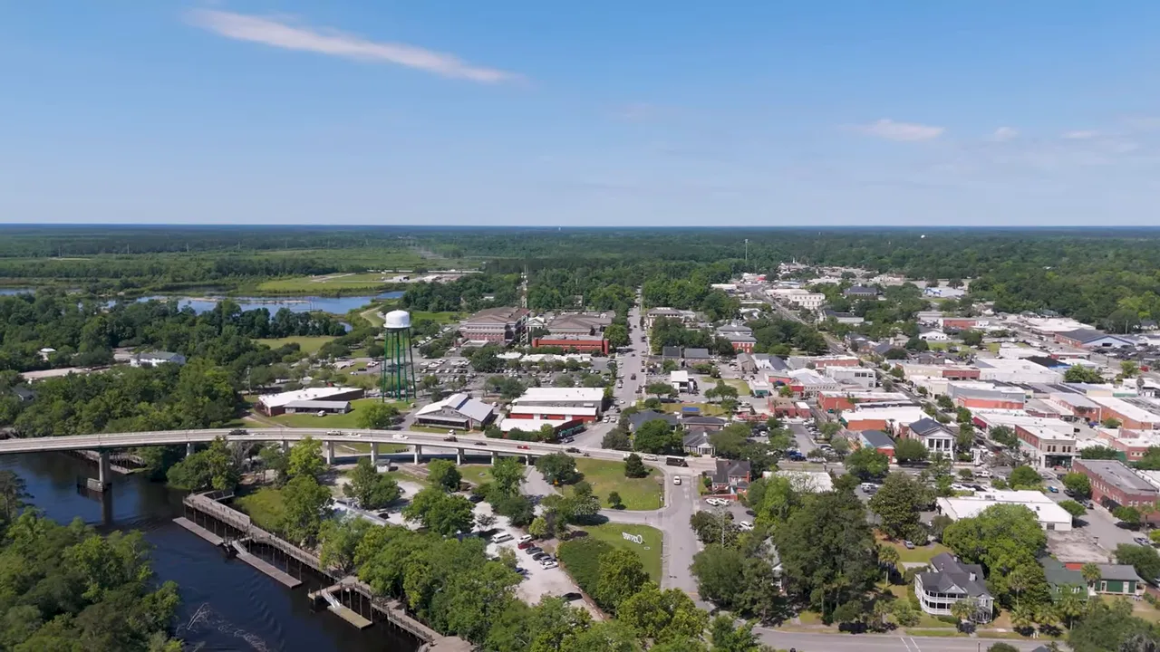 Aerial view of downtown area with buildings and river in the distance