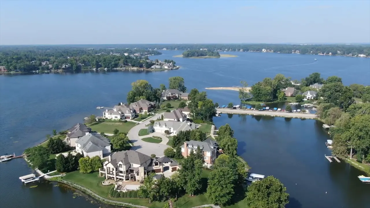 Aerial view of large waterfront homes on a peninsula at Geist Reservoir